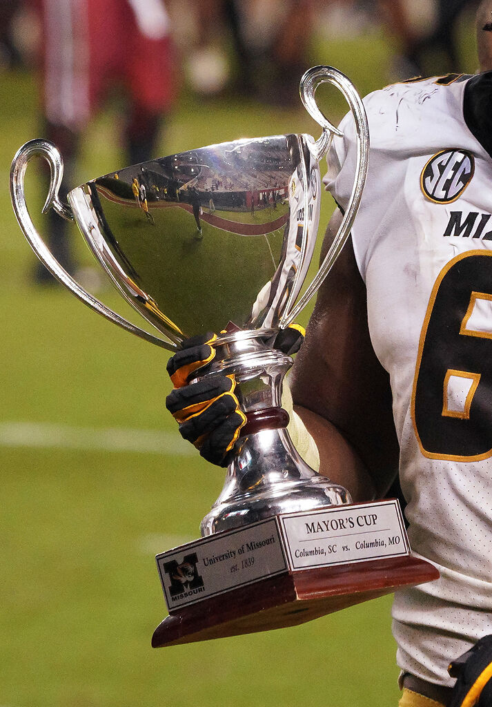 Darius Robinson carries the Mayor's Cup
